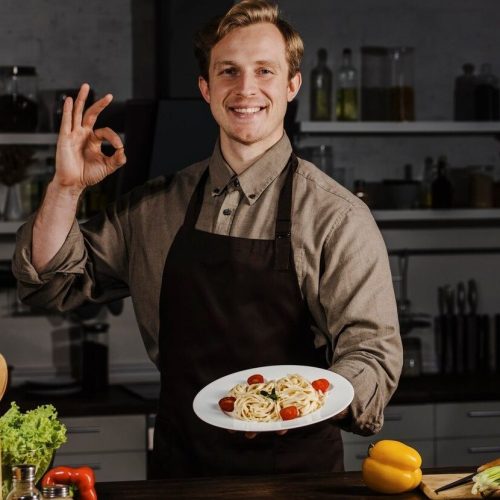 imgi_61_mid-shot-chef-holding-plate-with-pasta-making-ok-sign_23-2148794087